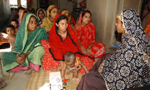 female health worker interacting with clients 