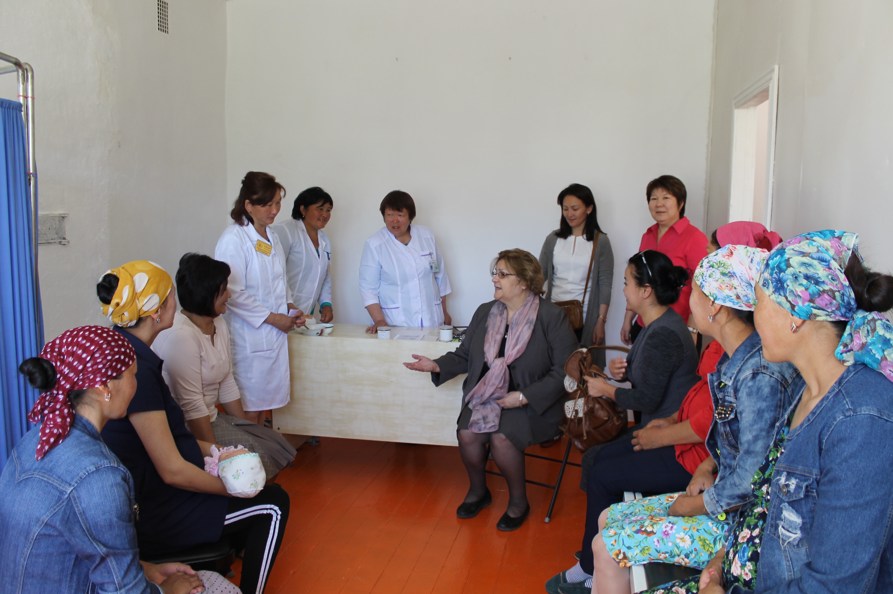 During visit to a health outpost in Jan-Bulak Village, Ambassador Gwaltney joins a birth preparedness class with expectant mothers from the community.