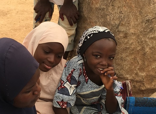 Young girls listen to an interview with a newly married woman who regularly attends CIYCF support group meetings.