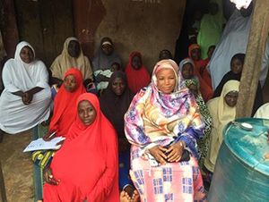 Hajiya Abdullahi talks with infant and young child feeding support group members in Toto, Nigeria.