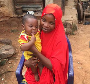 Zahila Abdulahi, who received help from a local feeding support group, shows off her healthy baby boy.