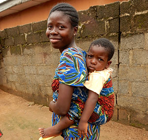 As a community volunteer, Mary Ohamije helps women like this member of a local C-IYCF support group adopt optimal infant and young child feeding practices.