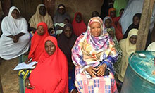 Hajiya Abdullahi talks with infant and young child feeding support group members in Toto, Nigeria.