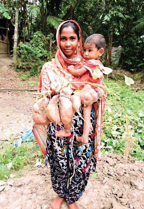 Photo of a woman holding an infant.