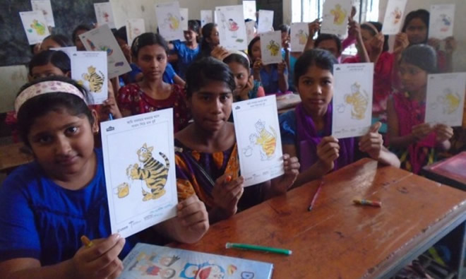 Children showing off their coloring for World Handwashing Day