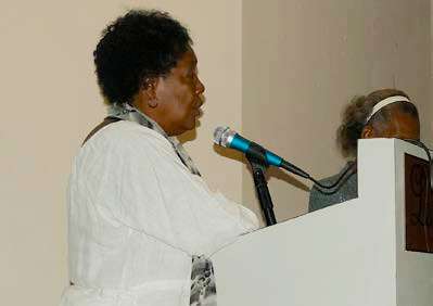 Photo of Dr. Pierre speaking at a podium