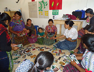 beneficiaries sitting in a circle categorizing their daily diet