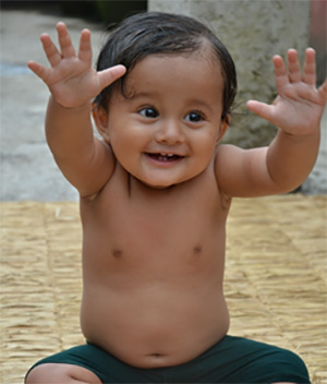 baby with hands up