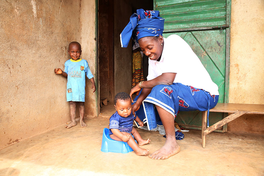 During a home visit, the team observed how a mother potty trains her child.