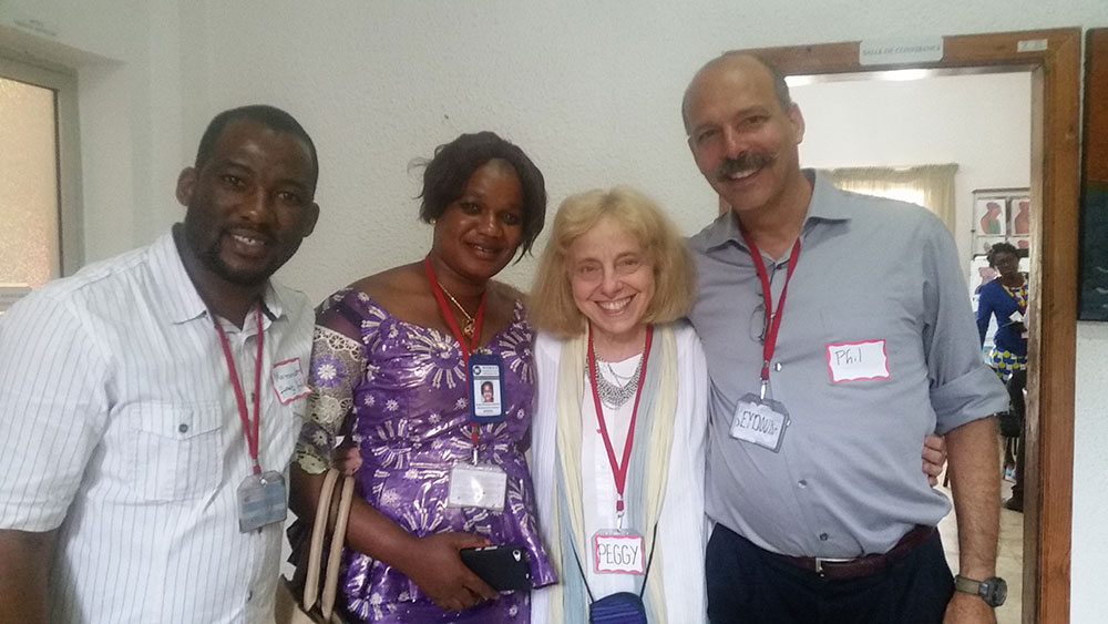 Phil Moses and Peggy Koniz-Booher from the SPRING SBCC team congratulate SPRING/Guinea staff Mamadou Hady Diallo and Hadja Mariama Konaté.
