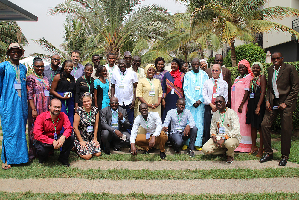 SPRING staff pose for a photo at the end of the close-out event in Dakar.