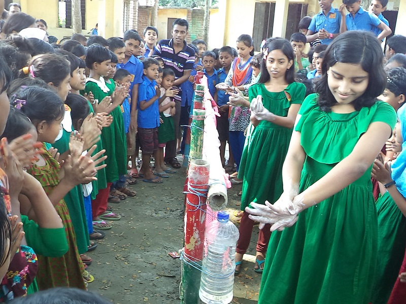 Girls demonstrating handwashing