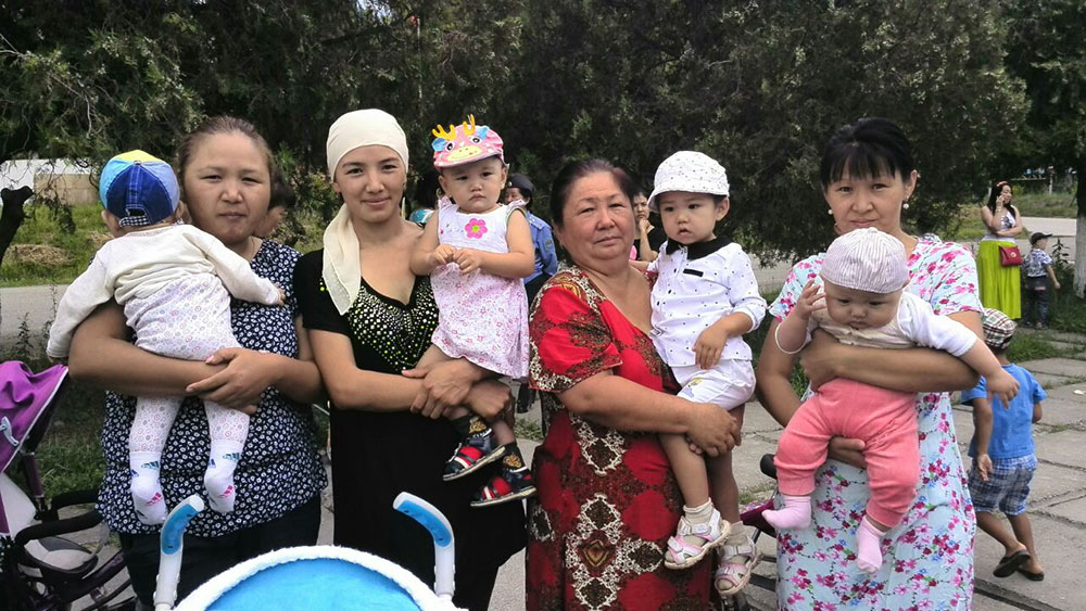 Mothers and infants participate in the Kara Kul town World Breastfeeding Week event in the Kyrgyz Republic in 2016.