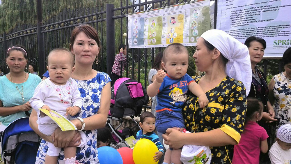 Mothers and infants participating in the Kara Kul town World Breastfeeding Week event.