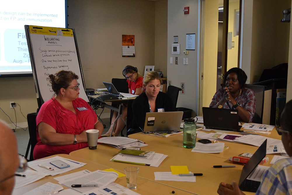 Participants discuss service integration models in a breakout session.