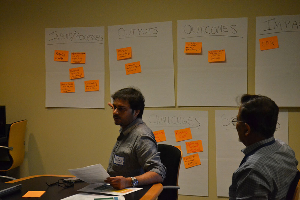 Participants discuss M&E frameworks in a breakout session.