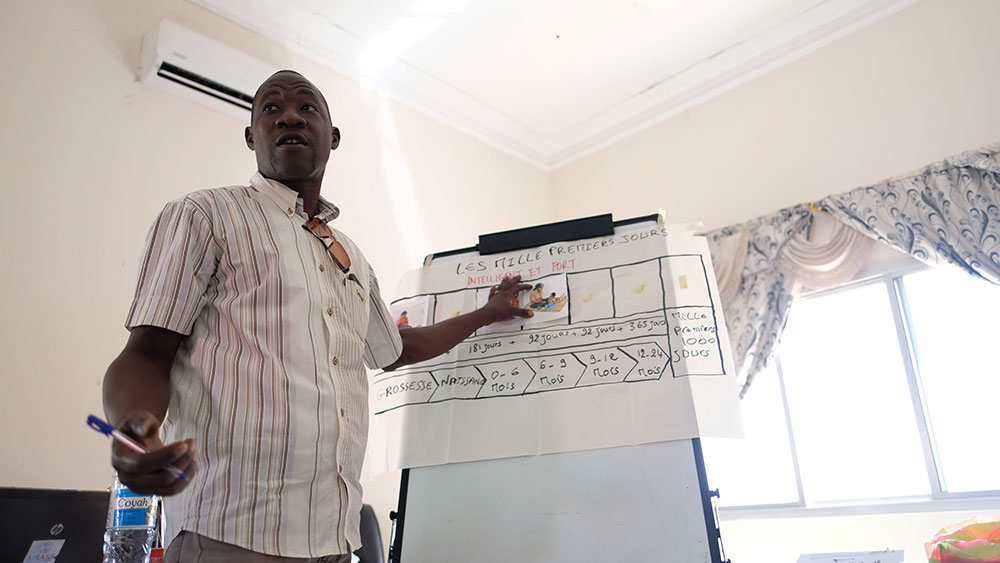 A participant, Ibrahima, shares his group’s work on identifying a stage of the first 1000 days. 