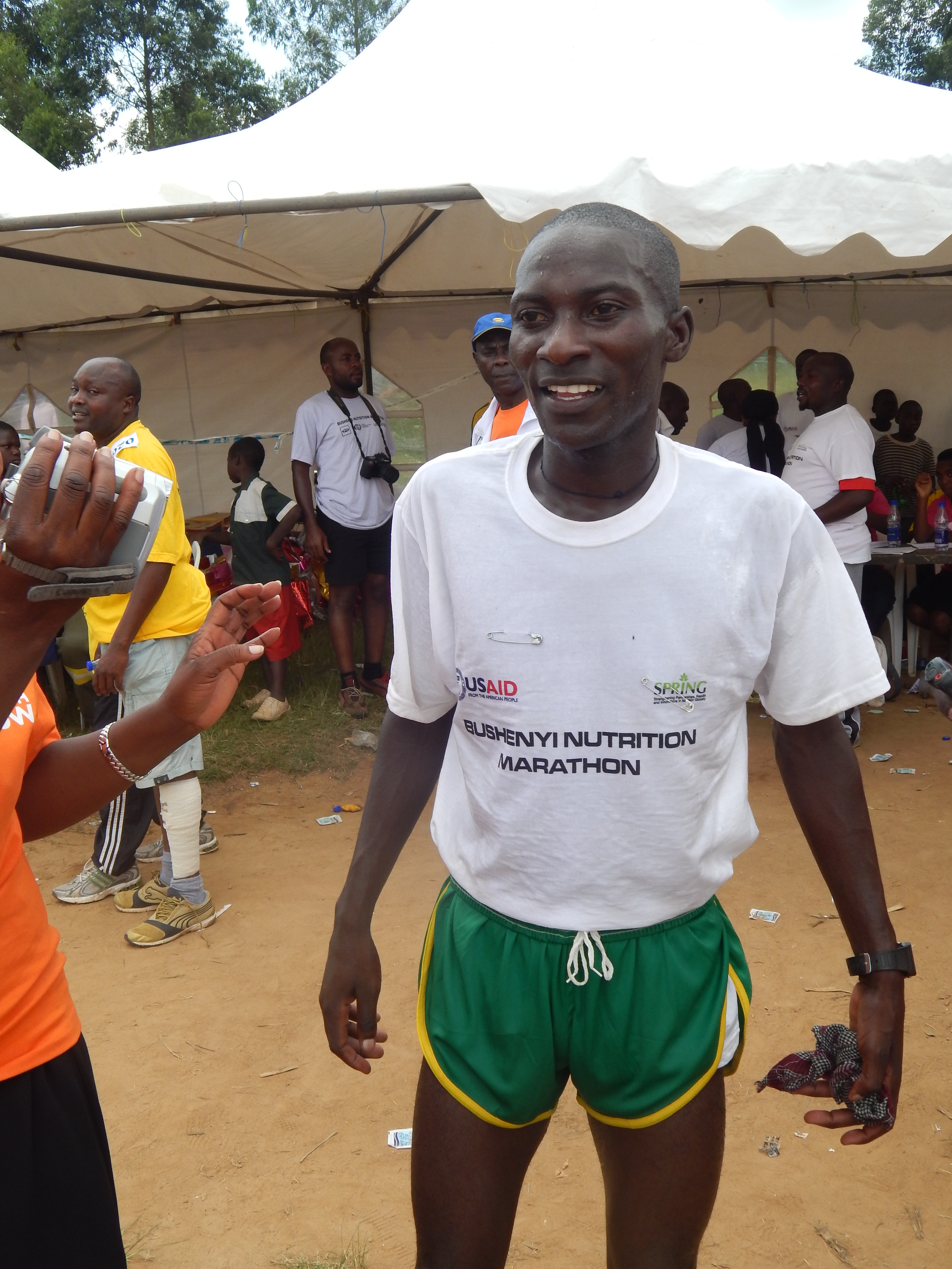 The winner of the 1st Bushenyi Nutrition 21km, proudly dressed in SPRING-provided T-shirt!