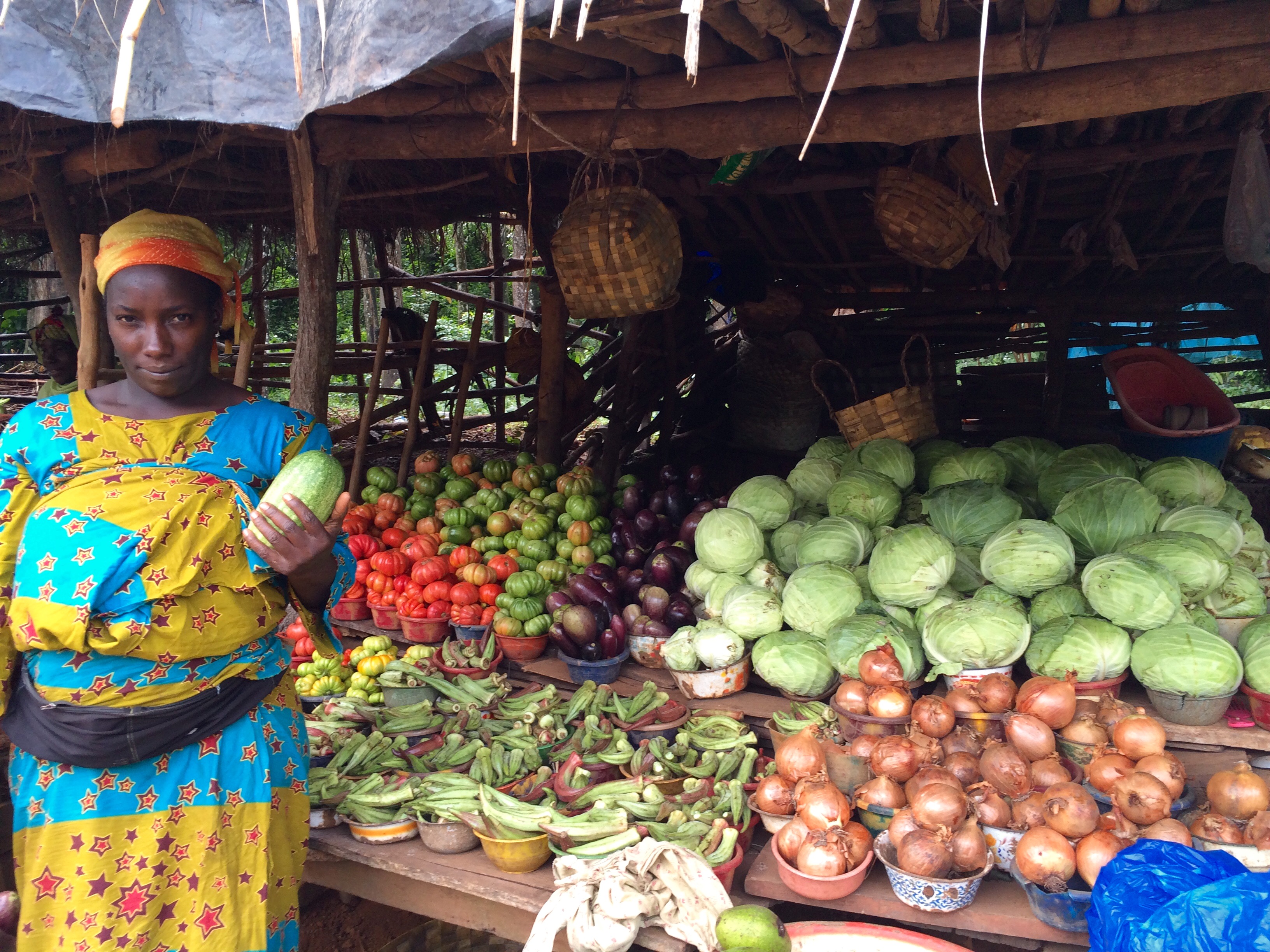 Market woman with her vegetables