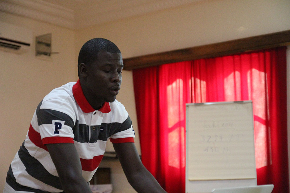 SPRING consultant Ahmed Massamba Thiam trains participants to use video editing software Adobe Premiere Pro. 