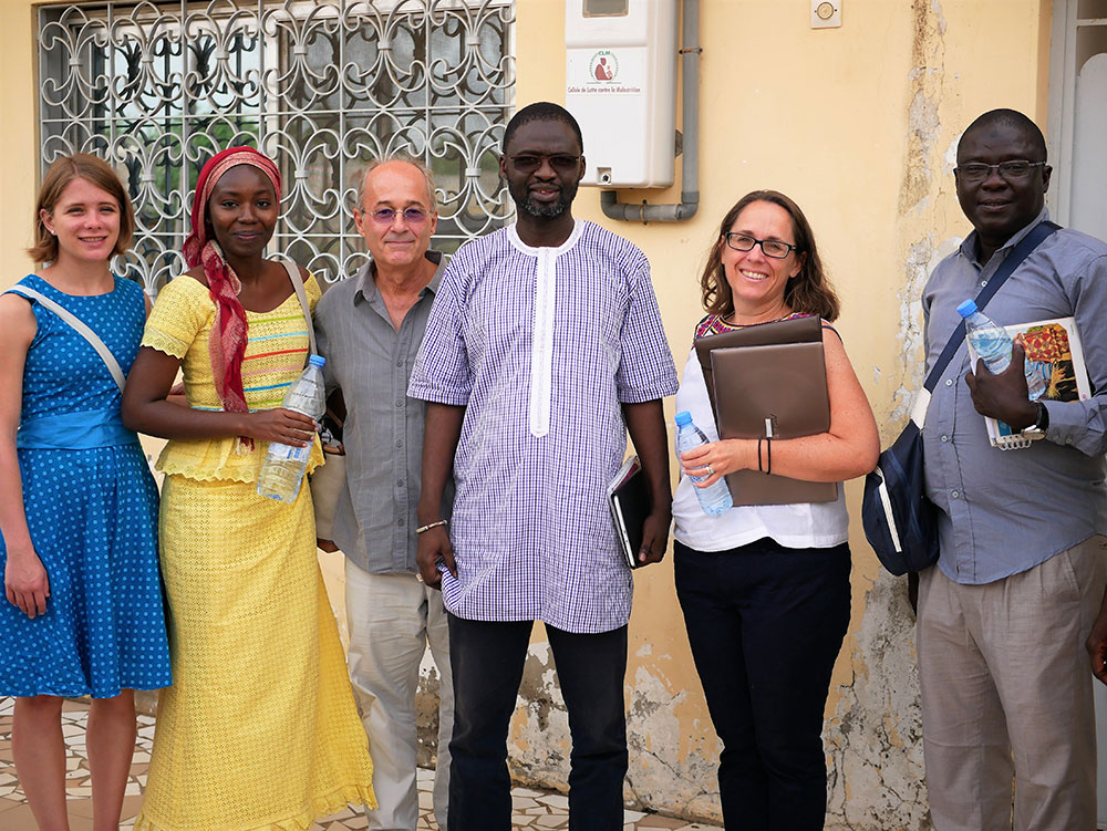 SPRING’s Kate Litvin, Mariam Sy, and Bob de Wolfe pose with Alioune Badara Fall of the regional governmental agency “Cellule de lutte contre la malnutrition” (Unit of the Fight Against Malnutrition), along with Megan Kyles of USAID.
