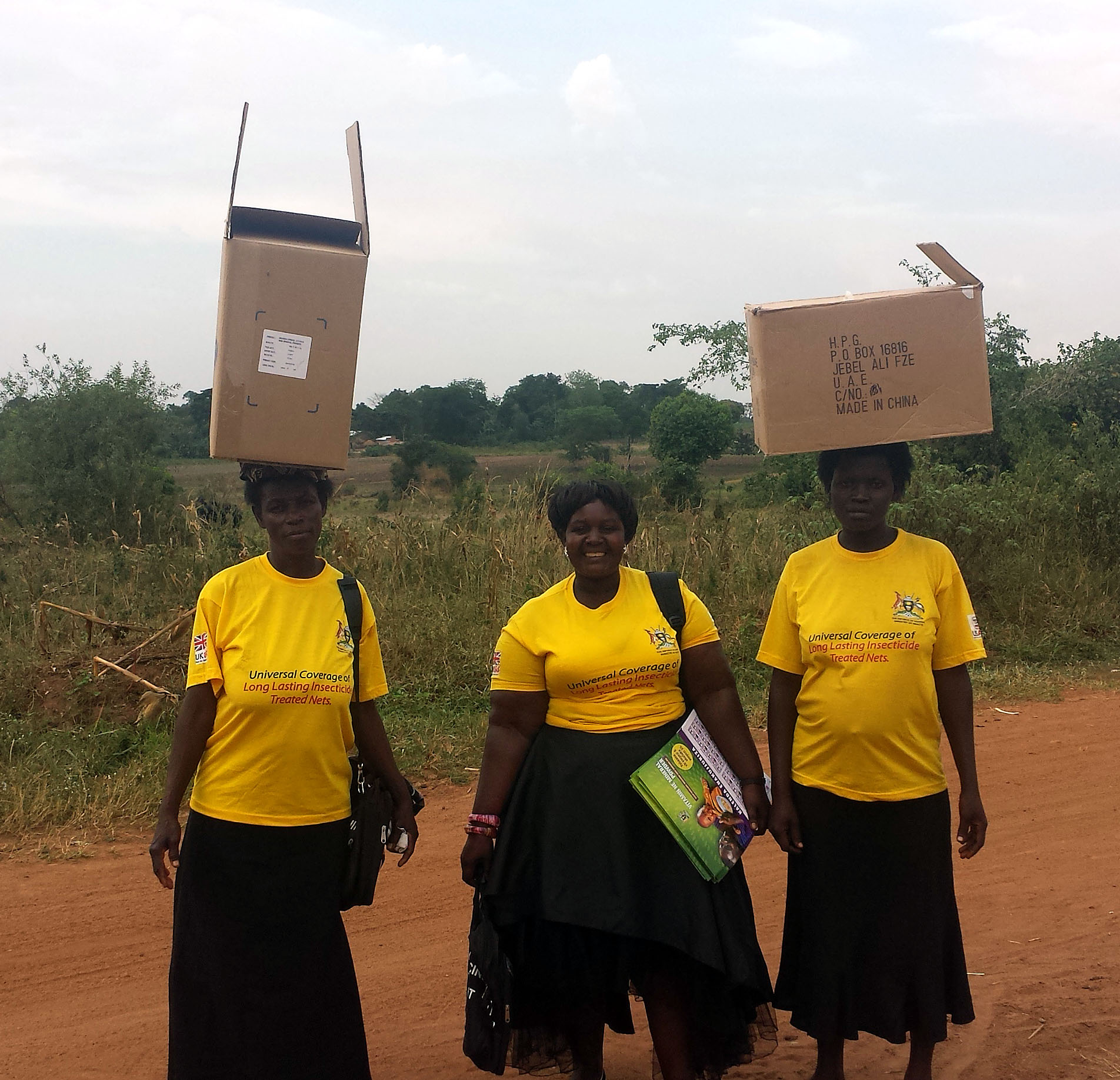 VHTs working with SPRING to distribute MNPs to households in Bulange sub-county.