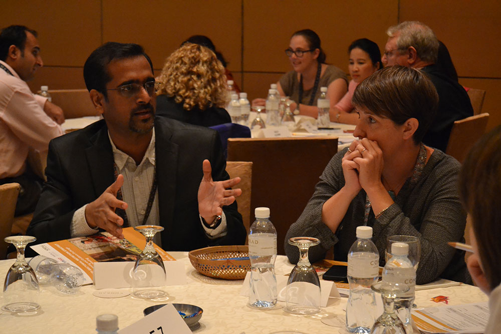 Vamsidhar Reddy and Carolyn O'Donnell discuss group work on “Introduction to Multi-Sectoral Programming, Collaboration, and Coordination.”