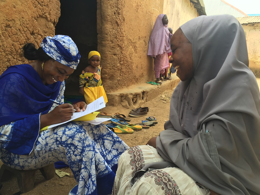 SPRING’s Study Coordinator, Ms. Susan Adeyemi, interviews Mrs. Jamila Garba, a C-IYCF Community Volunteer in Kasuwan Magani ward in Kajuru LGA.