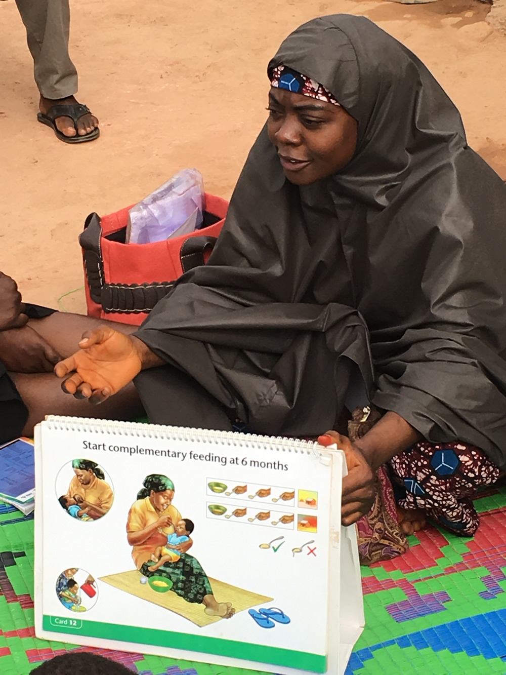 Mrs. Maryam Adams, a C-IYCF Community Volunteer in Kasuwan Magani ward in Kajuru LGA, discusses the introduction of complementary foods to children at 6 months of age.