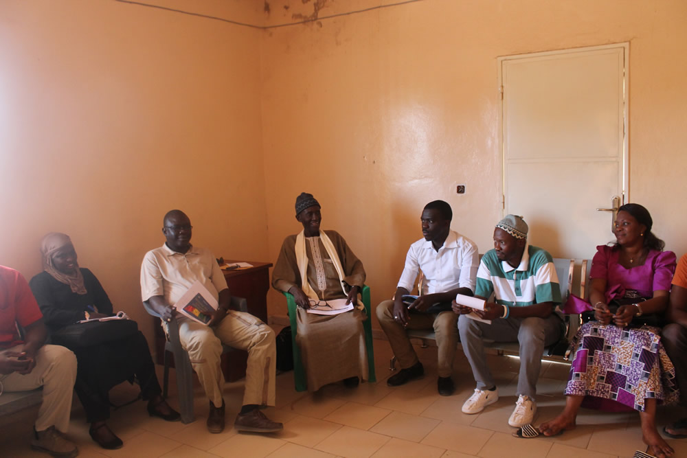 The SPRING/Senegal team holds a discussion with the staff of Kaffrine FM, one of SPRING's community radio partners in the region.