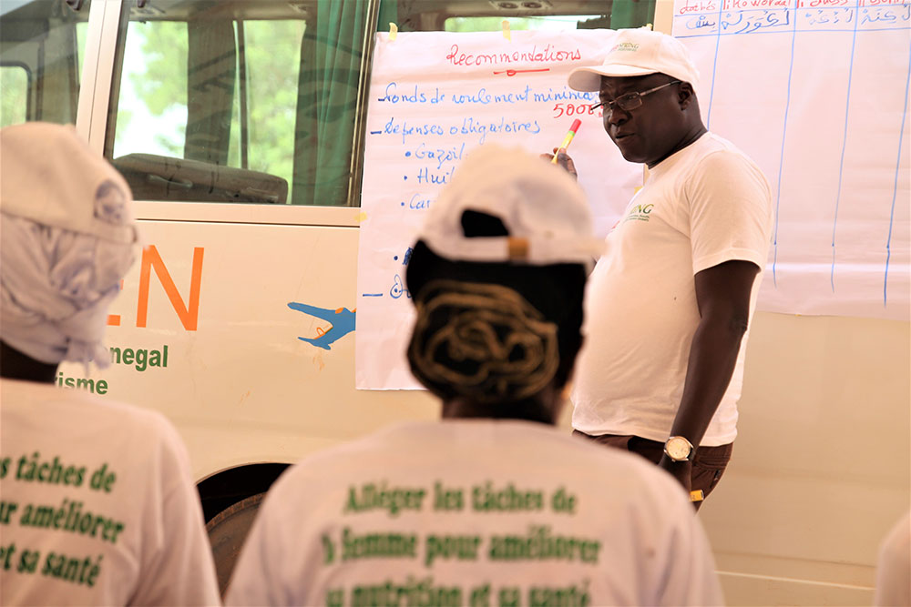 Aliou Babou of SPRING/Senegal helps participants understand the financial aspects of the operation and maintenance of the transformation units.