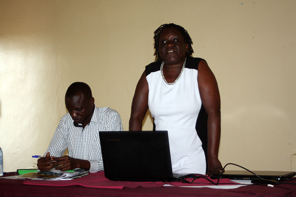 Senior Nutritionist with the MOH, Sarah Ngalombi, opens the dissemination meeting with the Regional Nutritionist for Jinja General Referral Hospital, Toko Mansur.
