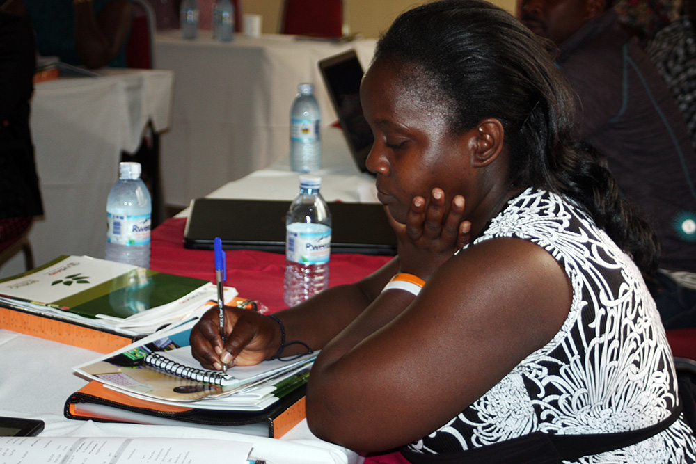 Antonia Kiro, an intern at the MOH, takes notes during the MNP dissemination meeting.