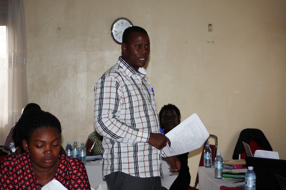 Martin Bulamu, Monitoring and Evaluation Officer at the Ministry of Health, giving a presentation.