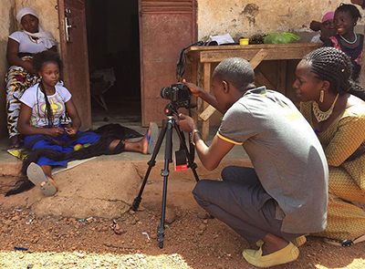 Photo of a team filming a community video