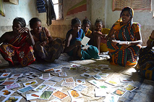 Photograph of a group of women in India using instructional cards