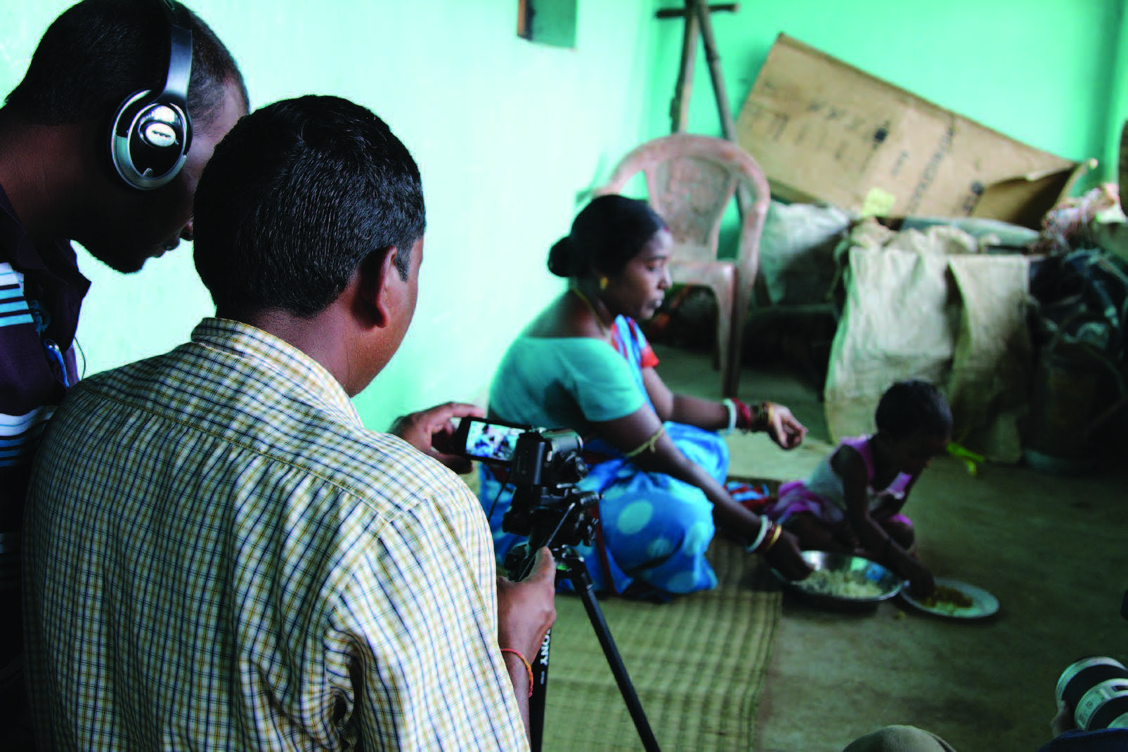 Cover image featuring a film crew making a community video. 
