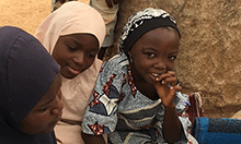 Young girls listen to an interview with a newly married woman who regularly attends CIYCF support group meetings.