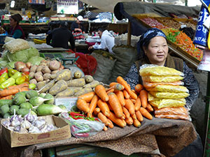 Woman selling produce at market