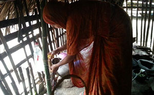 FNS participant uses the Tippy Tap set up in her kitchen, Khulna.