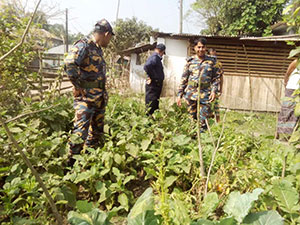 Officer Islam tours the vegetable garden