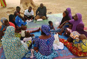 Members of an infant and young child feeding support group meet in Ichecheni, Nigeria.