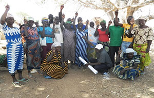 Community members in Kubone express their excitement after participating in a community-led total sanitation triggering exercise.
