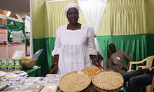 SPRING/Senegal partner, FEPROMAS, displays grains of highly nutritious Obatampa maize. 