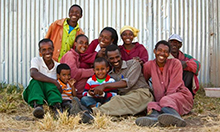 Cover image of the Session Guide: a group photo of a family smiling.